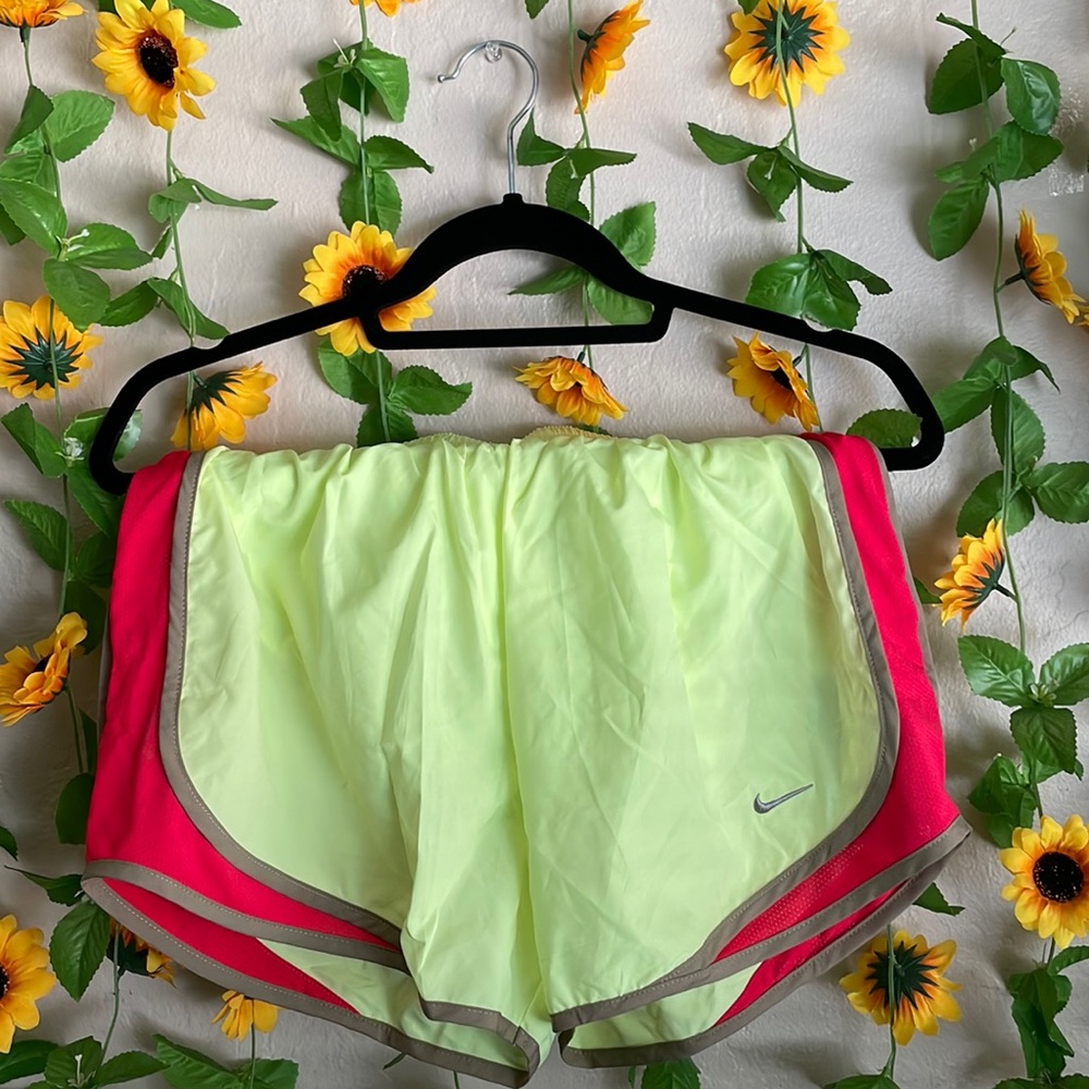 Neon green/yellow Nike Dri-Fit running shorts in a size M